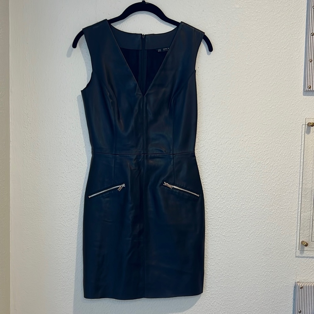 Black Faux Leather dress with two front zipper pockets.